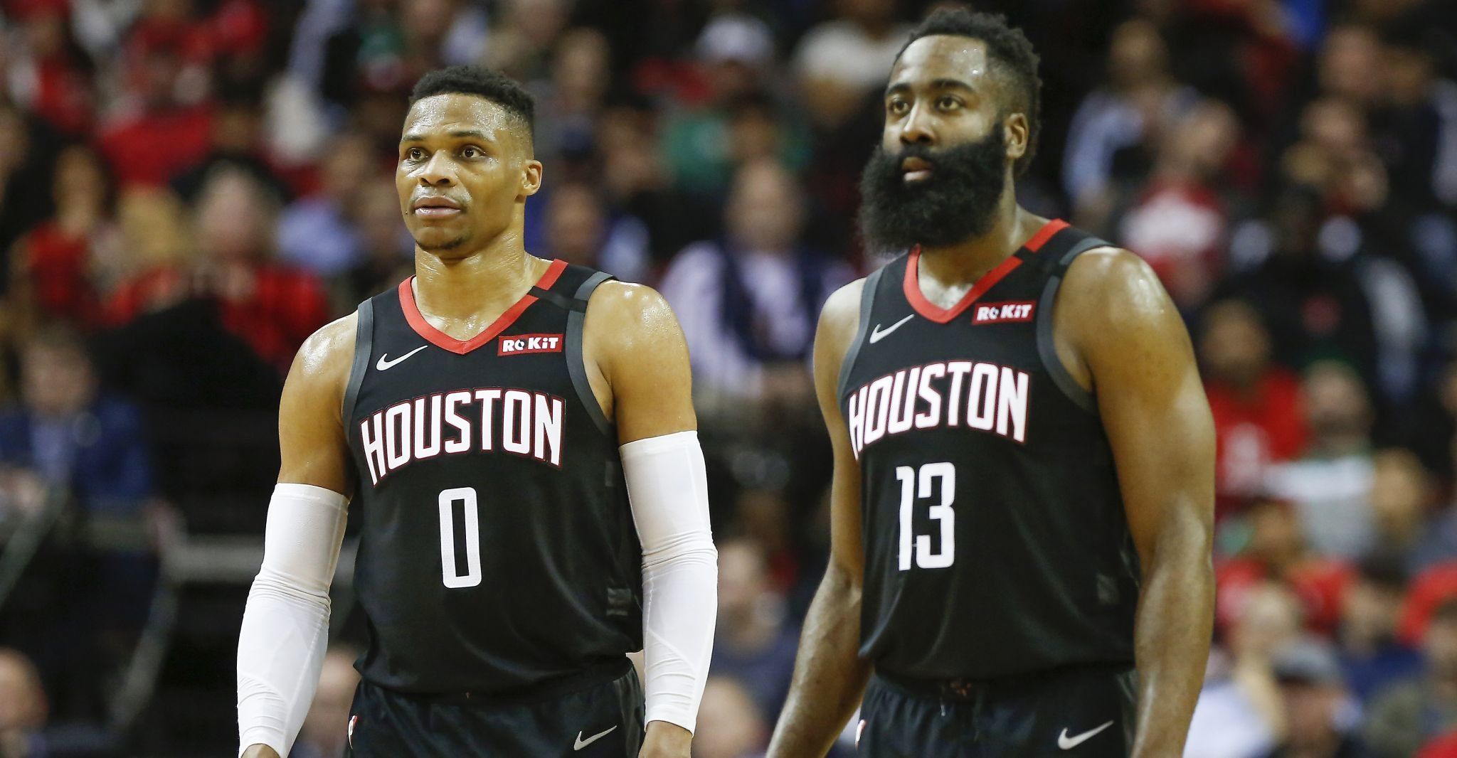 Houston Rockets guards Russell Westbrook and James Harden stand together at mid-court.