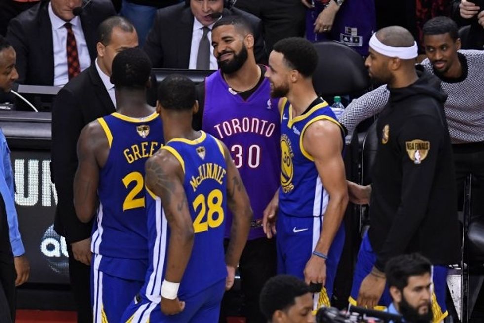 Drake, and members of the Golden State Warriors during last year's finals