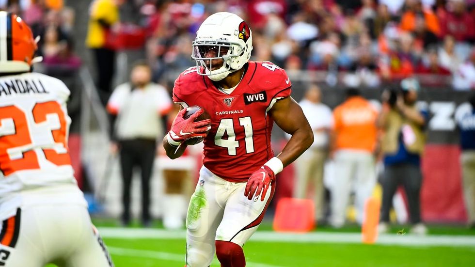 Kenyan Drake running with football.