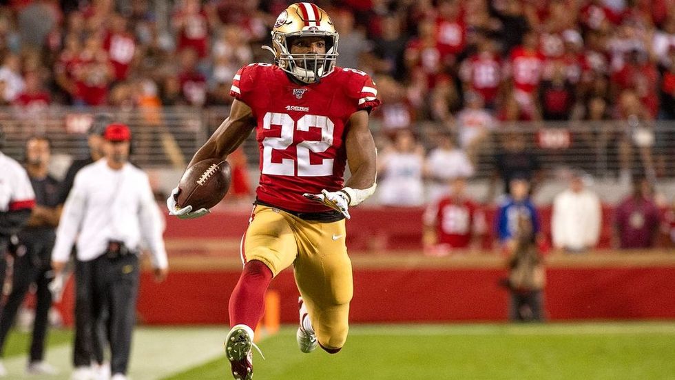 Matt Breida running with football