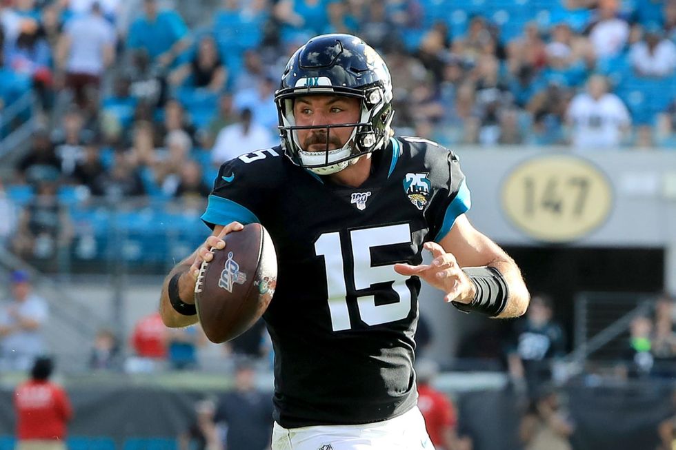 Gardner Minshew throws a football