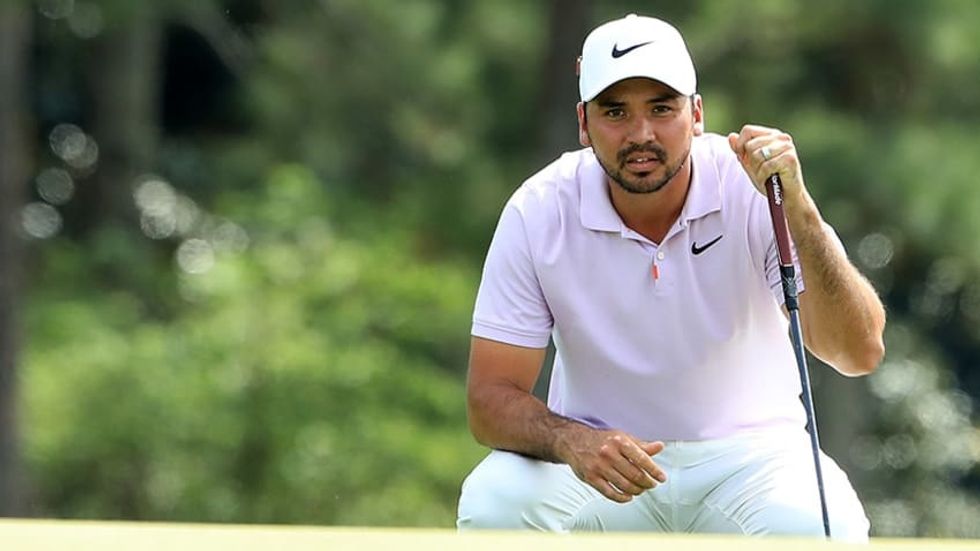 Jason Day lines up a putt