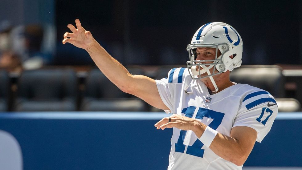 Colts QB Philip Rivers warms up during a padded practice